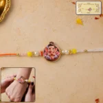 Ganesh Ji Designer Rakhi with Yellow Beads (1 Pc)